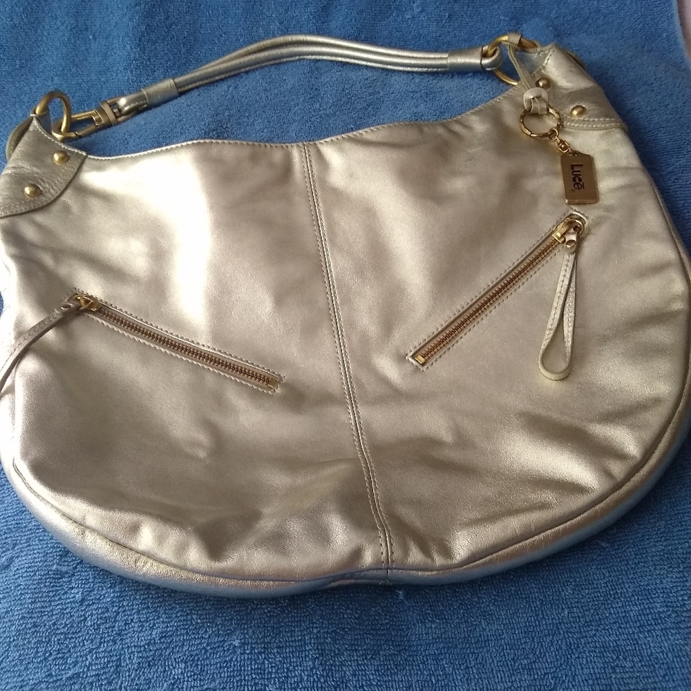 Live gold metallic hobo purse.